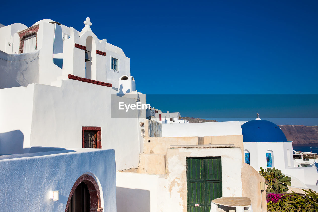 Traditional architecture of the churches of the oia city in santorini island