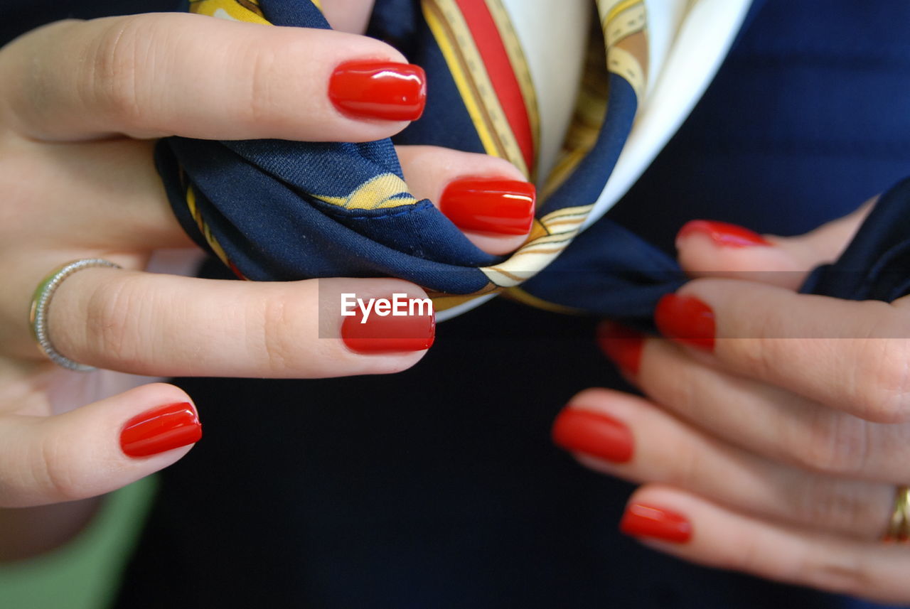 CLOSE-UP OF WOMAN HOLDING COLORFUL HAND