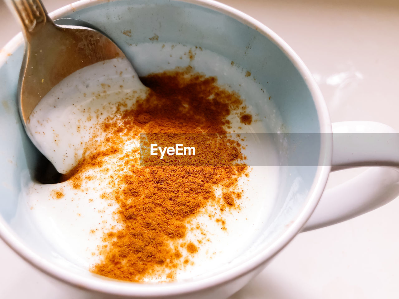 Kefir with cinnamon in a mug for boost the immune system. immunological and stomach benefits