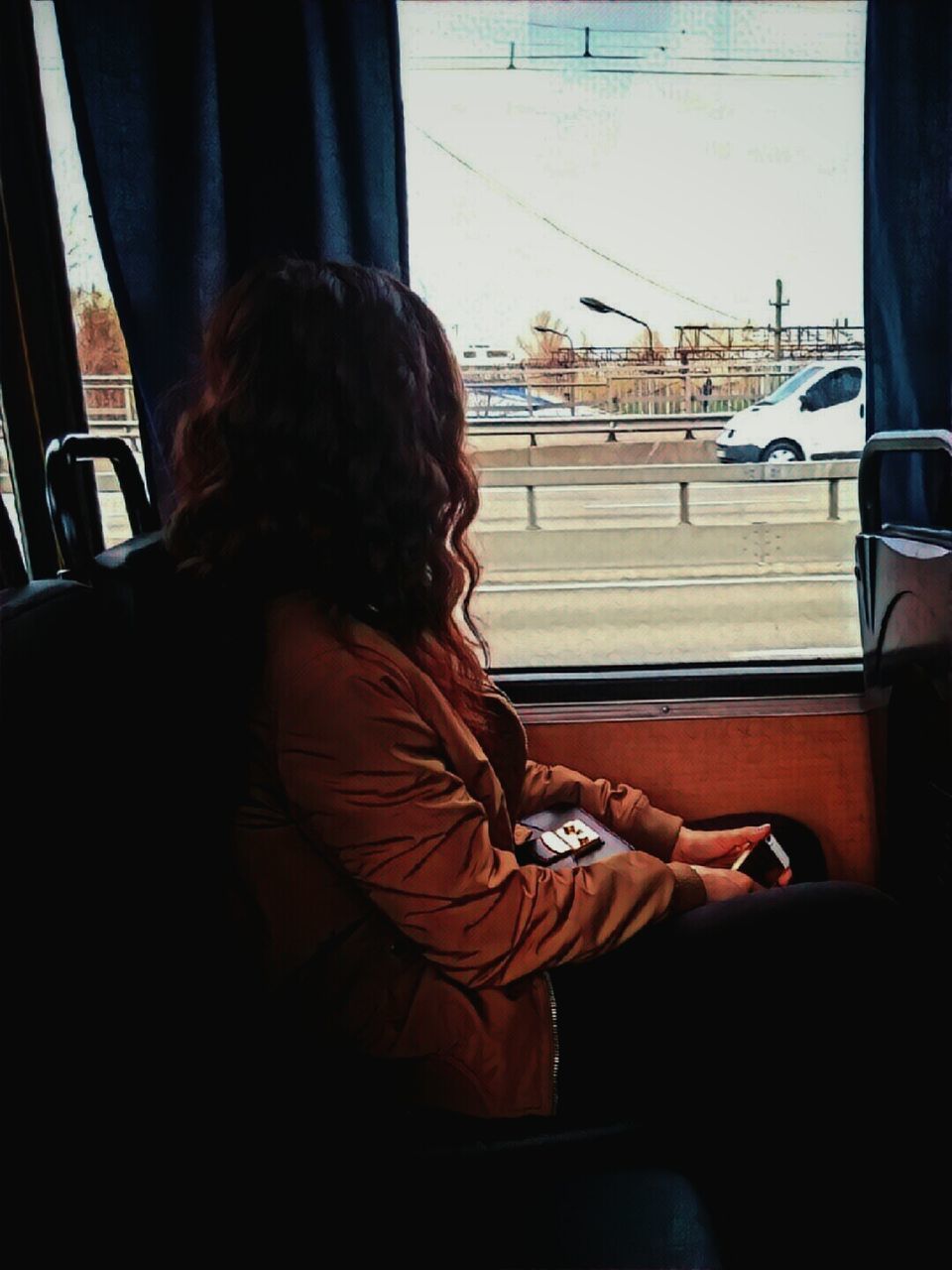 REAR VIEW OF WOMAN IN BUS