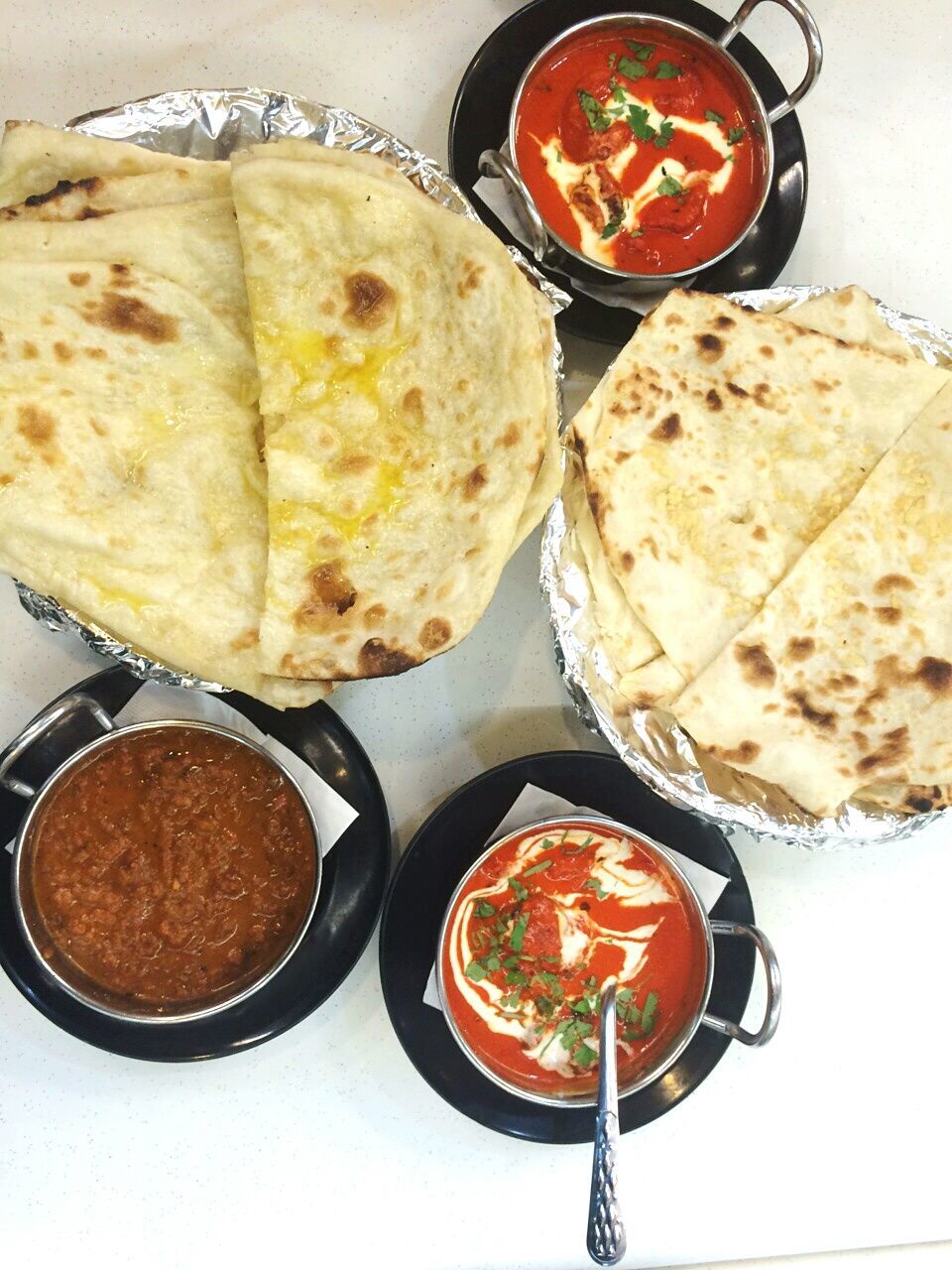 High angle view of bread and curry on table