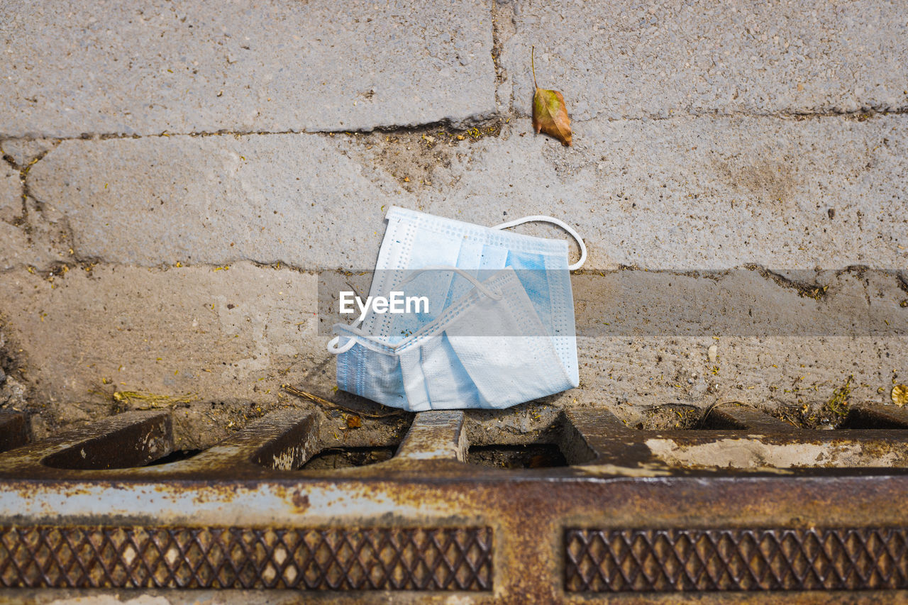 Directly above shot of surgical mask on floor