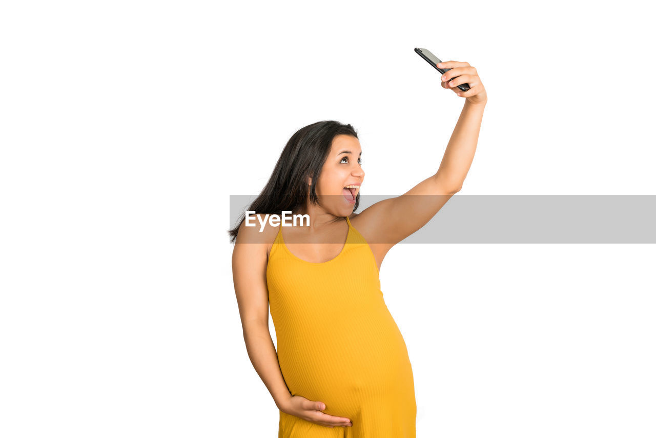 YOUNG WOMAN USING MOBILE PHONE