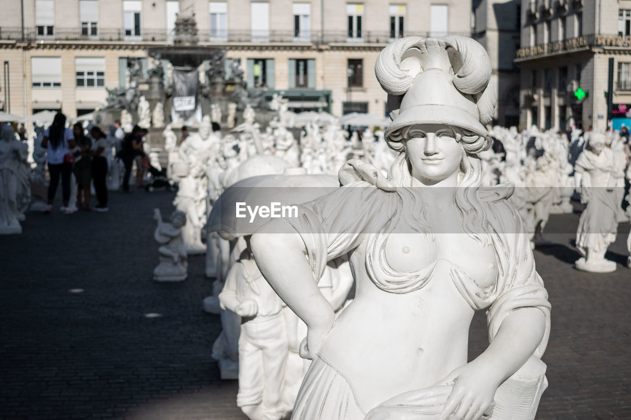 Close-up of statues in city