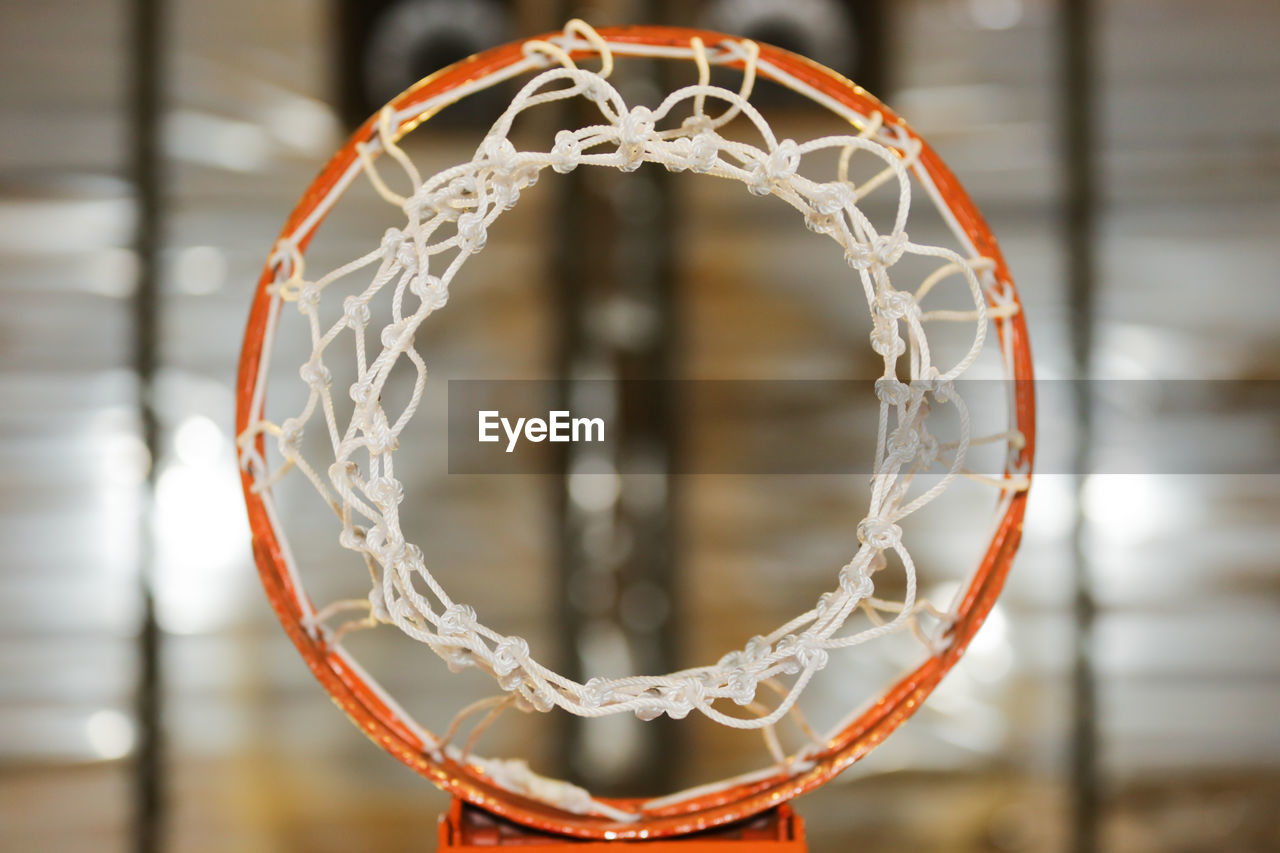 Directly below shot of basketball hoop