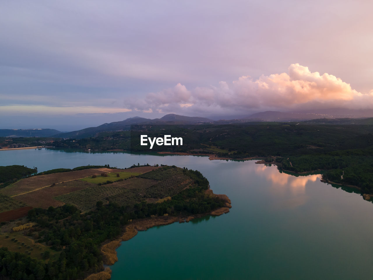 Scenic view of lake marathon against sky during sunset
