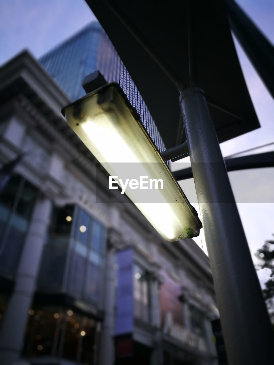 LOW ANGLE VIEW OF ILLUMINATED LIGHT AGAINST SKY