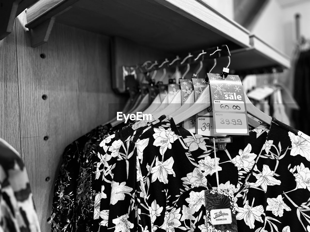 black, black and white, white, monochrome photography, hanging, monochrome, store, retail, no people, fashion, coathanger, shopping, clothing, focus on foreground, pattern, indoors, clothing store, business, business finance and industry, for sale