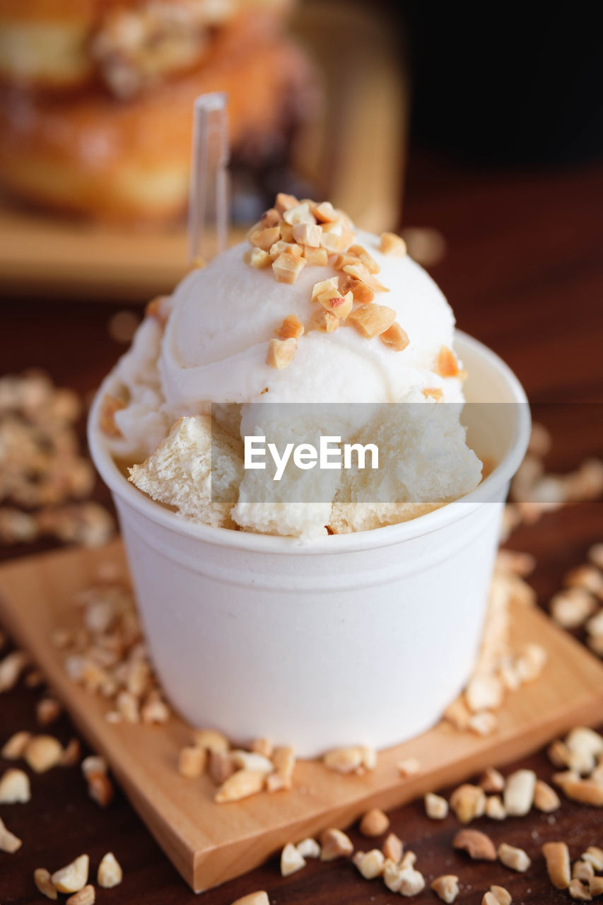 Close-up of ice cream in cup on table