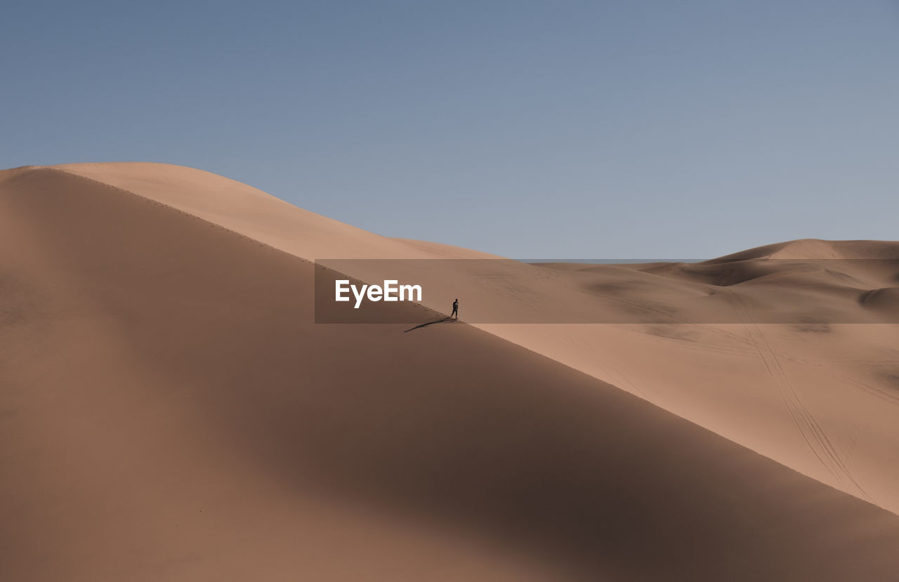 Scenic view of desert against clear sky