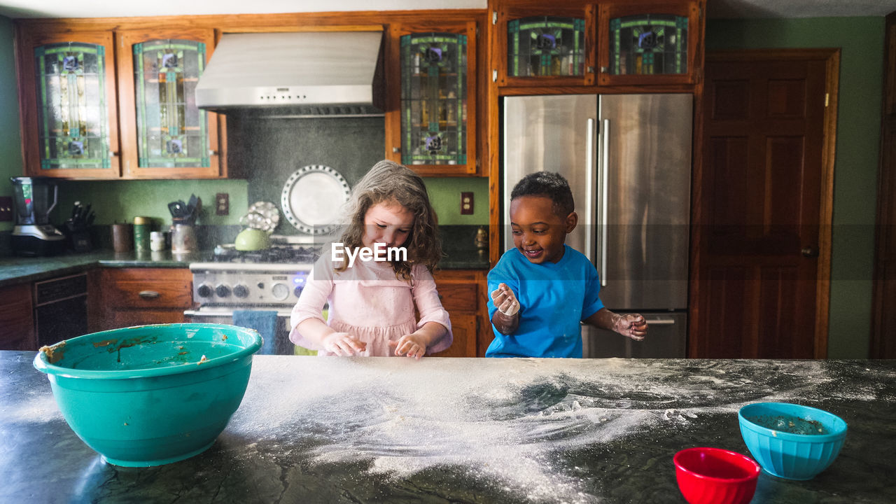 Kids making a mess in the kitchen