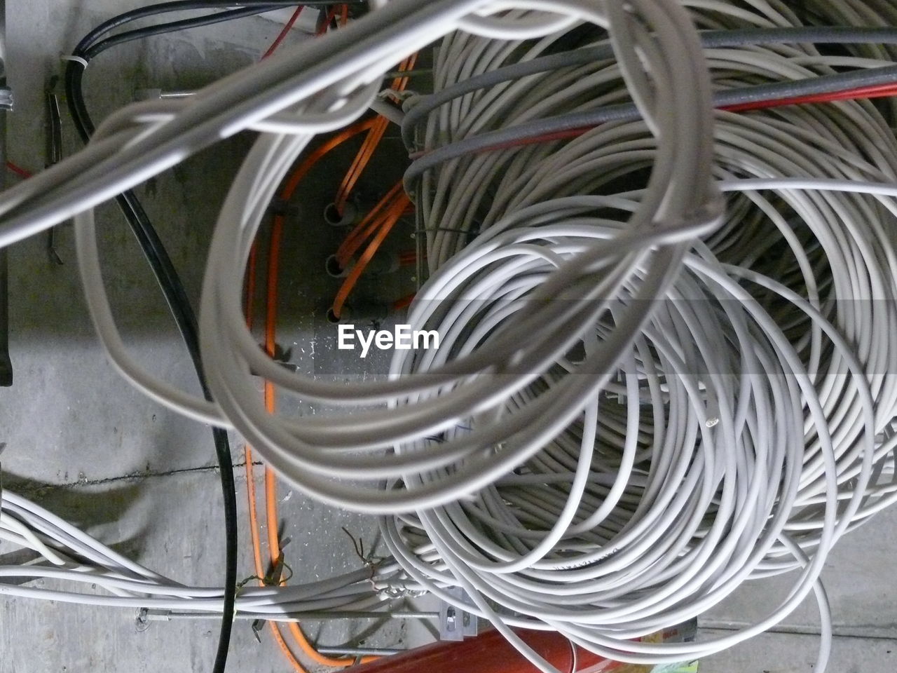 High angle view of tangled cables on floor