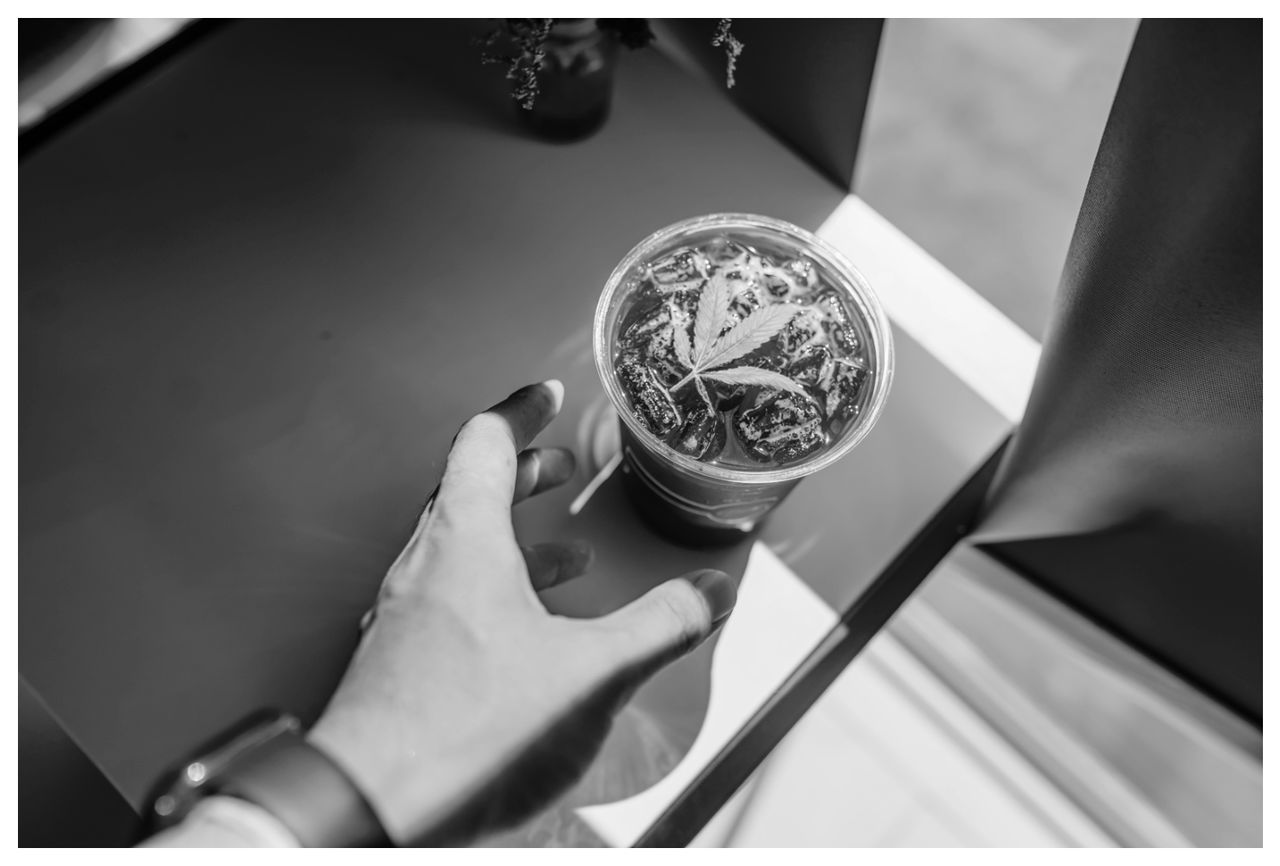 hand, black and white, holding, one person, transfer print, monochrome photography, auto post production filter, indoors, adult, food and drink, watch, close-up, ring, women