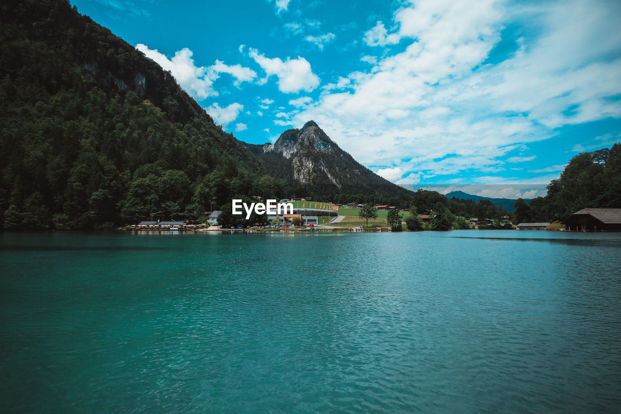 Scenic view of lake and mountains against sky