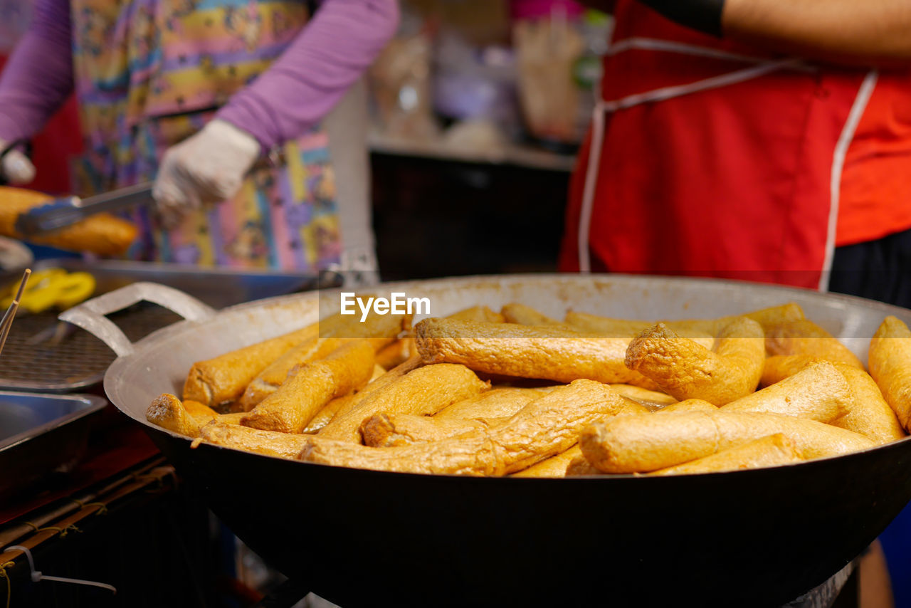 cropped hand of man preparing food