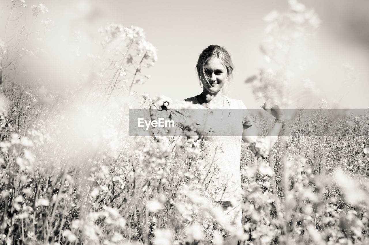 Woman on flowery field