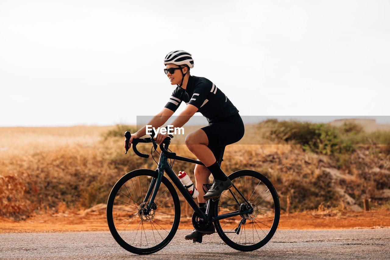 Man riding bicycle on road