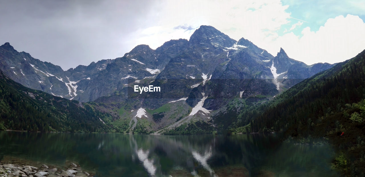 Wide angle view of morskie oko naturally formed lake pond in tatra mountains in poland. landscape