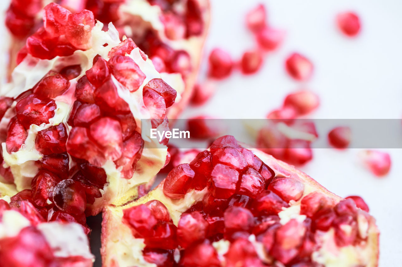 food and drink, food, pomegranate, fruit, healthy eating, red, freshness, seed, pomegranate seed, plant, wellbeing, berry, no people, produce, close-up, sweet food, berries, studio shot