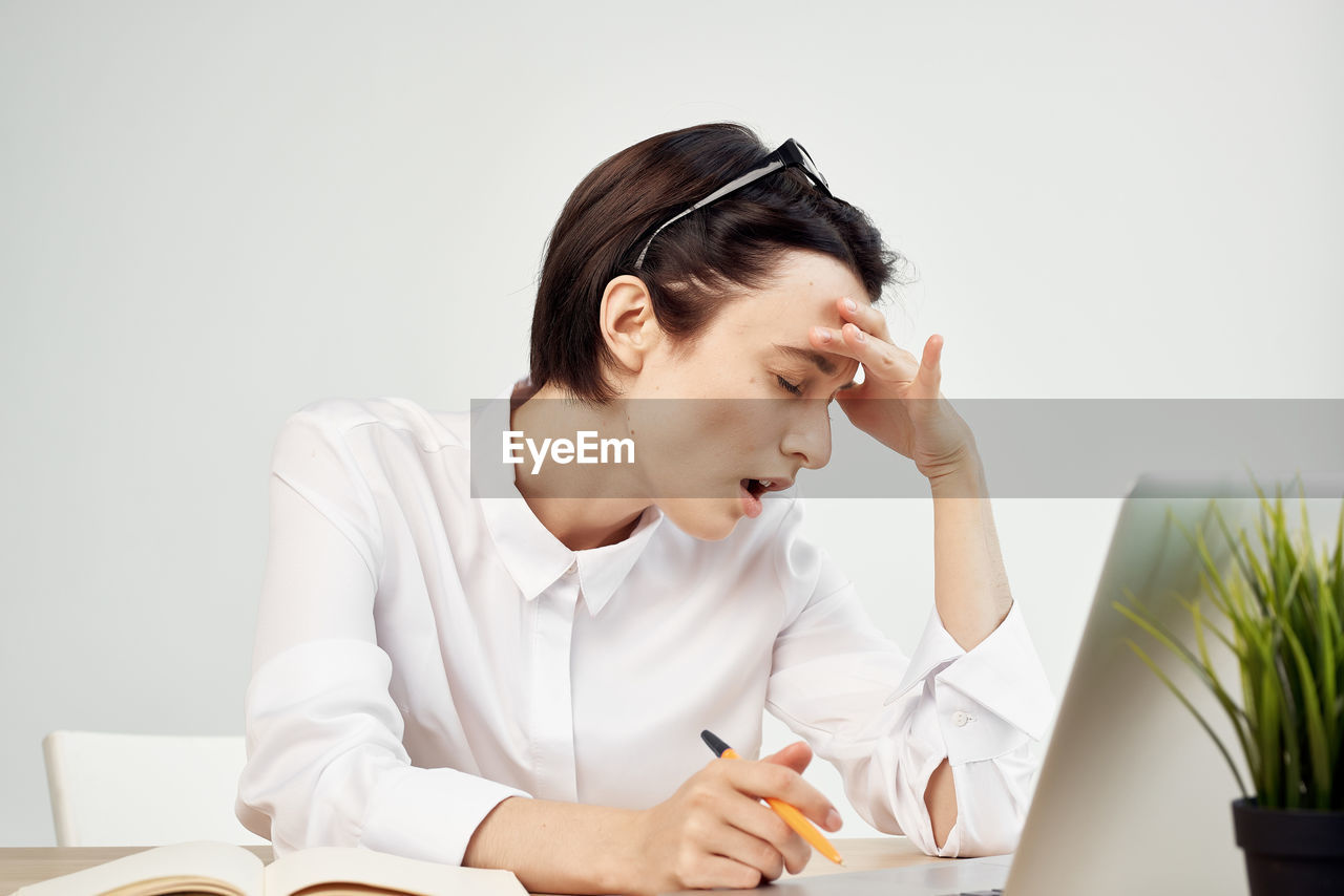 Young woman working on table