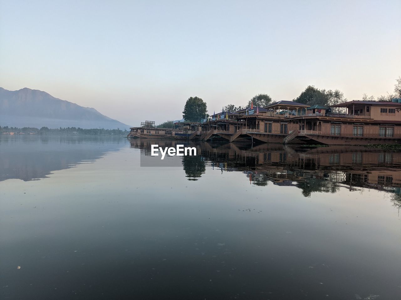 LAKE AND BUILDINGS AGAINST CLEAR SKY