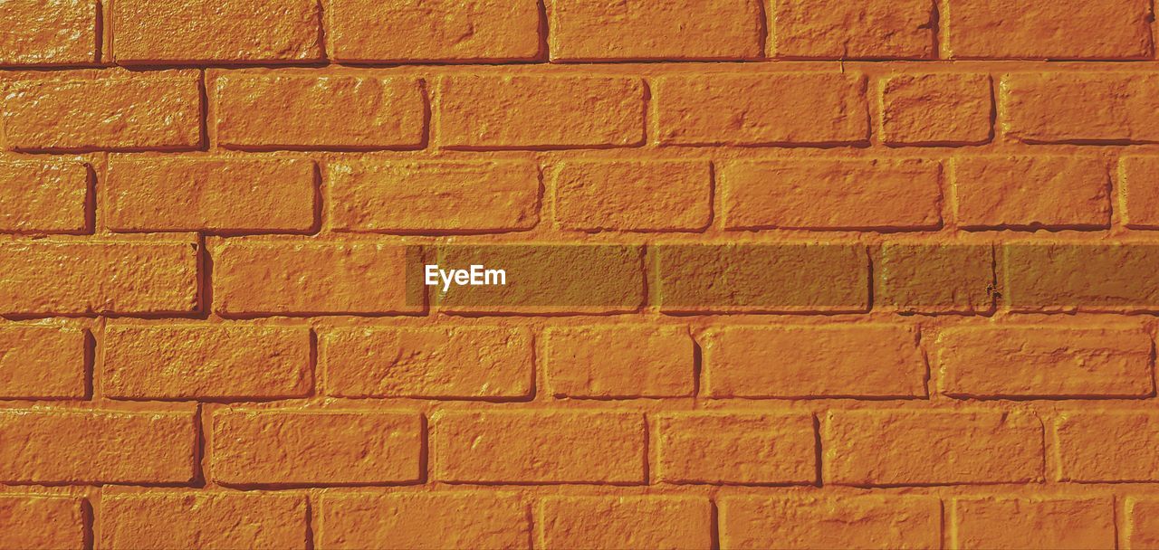 Full frame shot of brown brick wall