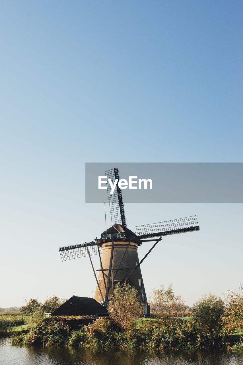 Traditional windmill against clear sky