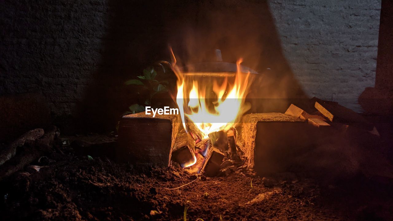 BONFIRE ON WOODEN LOG