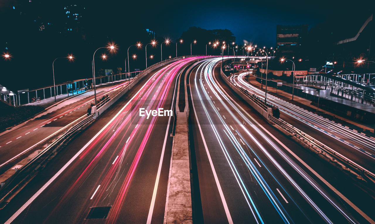 High angle view of light trails on road at night