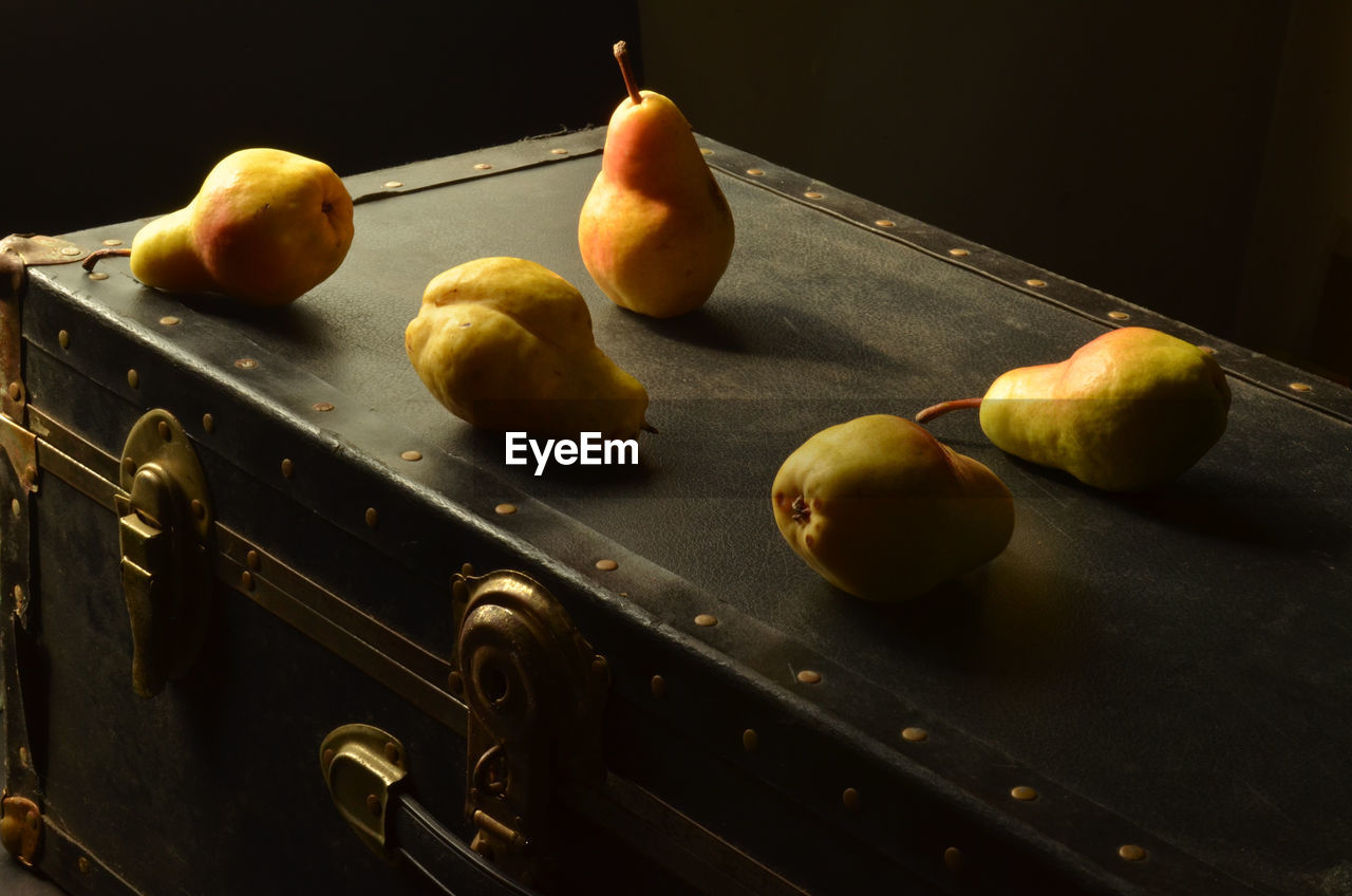 Pears on top of vintage trunk