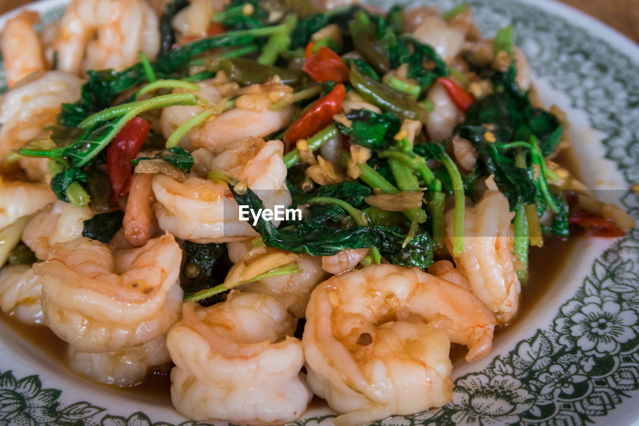 Thai basil stir-fried shrimp. asian street food market