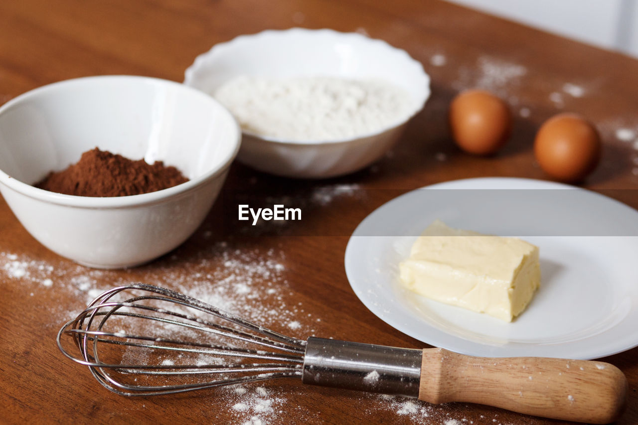 The ingredients needed for preparing homemade chocolate cupcakes