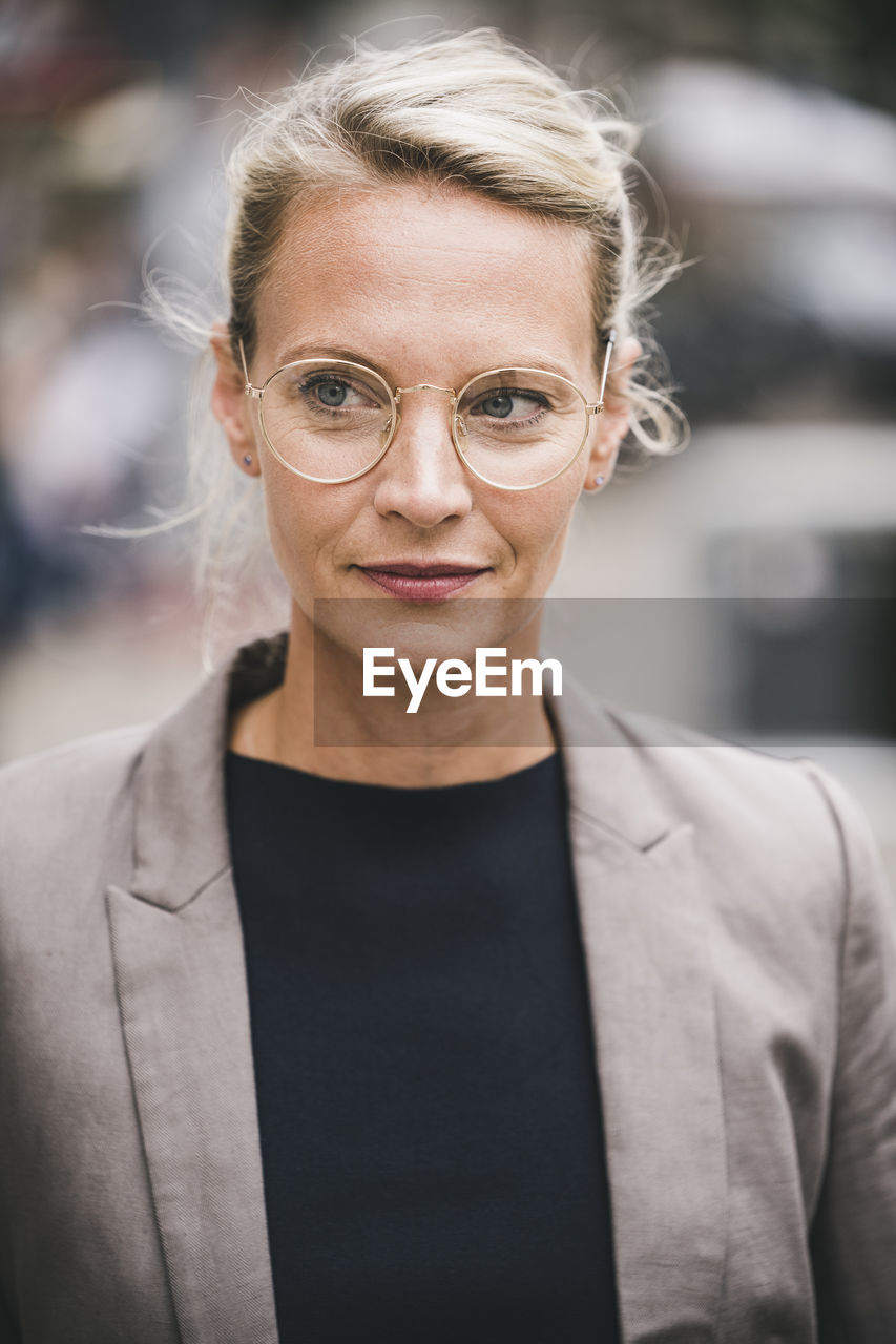 Blond businesswoman wearing eyeglasses