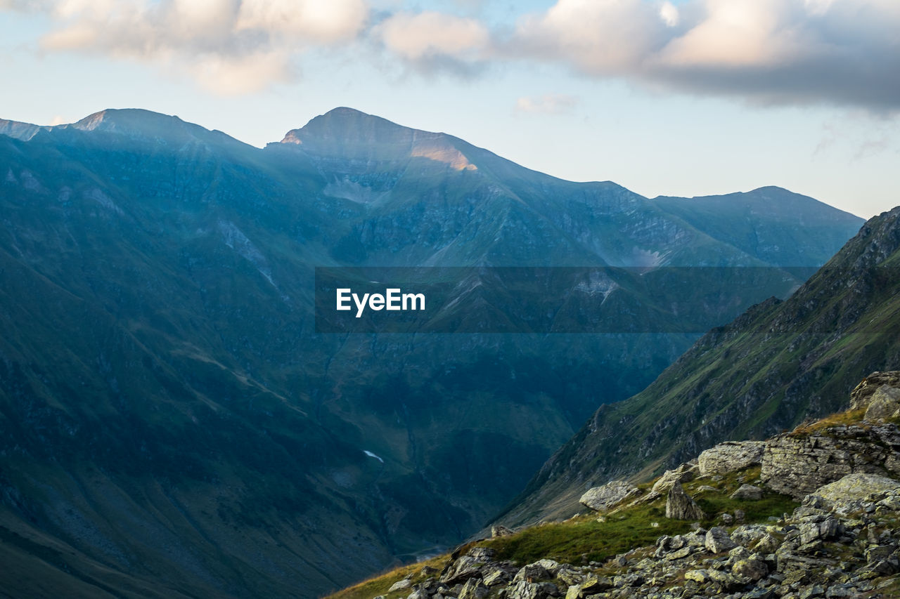 Scenic view of rocky mountains against sky, fagaras mountains, romania