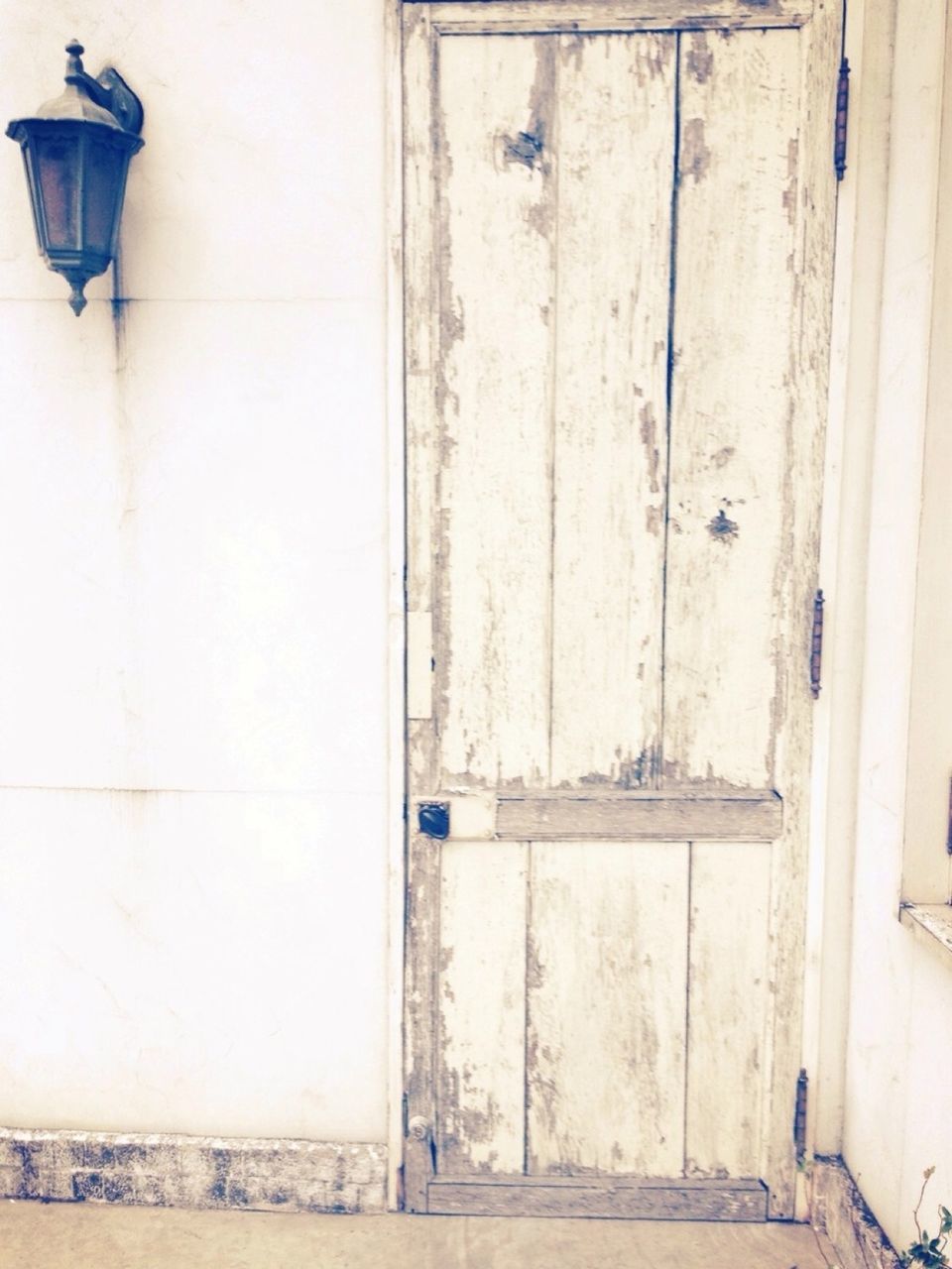 Old wooden door and lantern