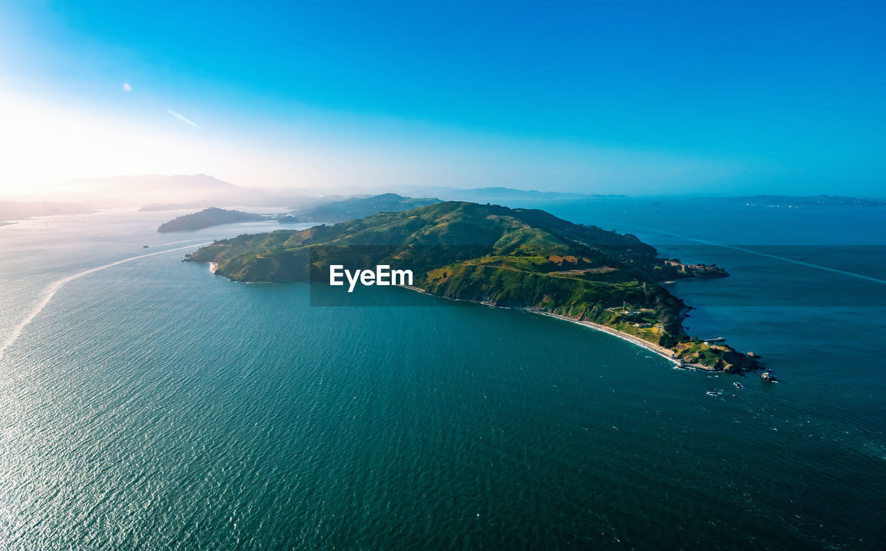 Aerial view of island in sea against sky