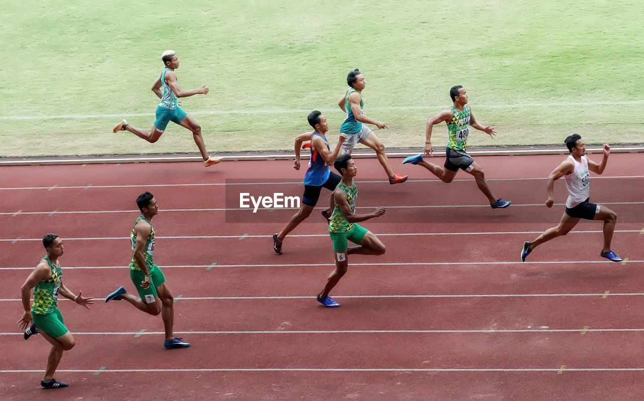 PEOPLE RUNNING AT STADIUM