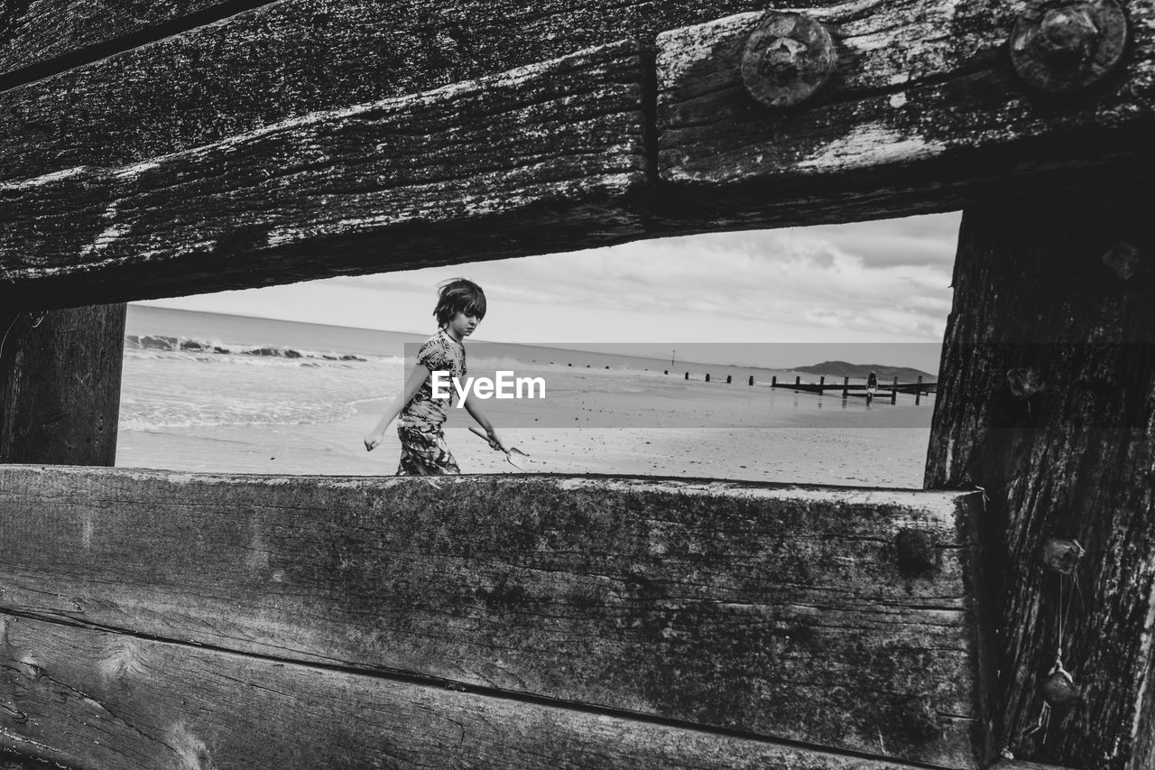 Boy framed on beach