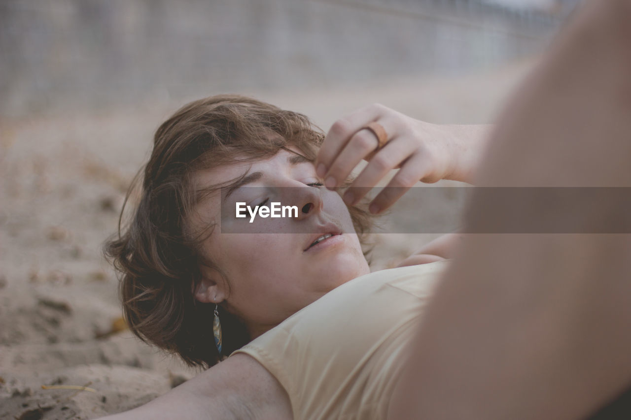 Woman with eyes closed at beach 