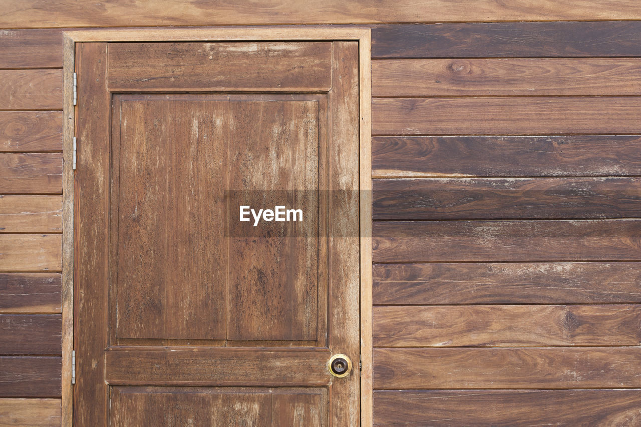 Closed door of wooden house