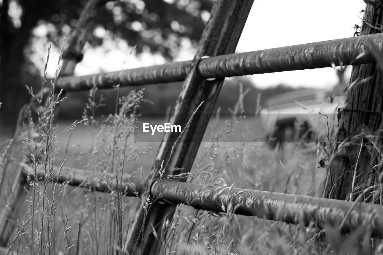 Rusty fence on field