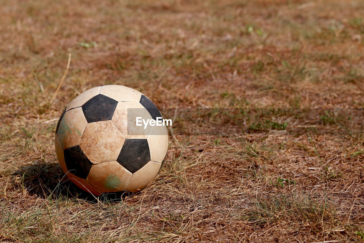 CLOSE-UP OF SOCCER BALL ON FIELD