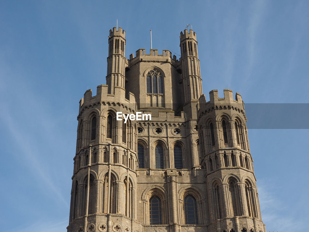 LOW ANGLE VIEW OF BUILDING AGAINST BLUE SKY