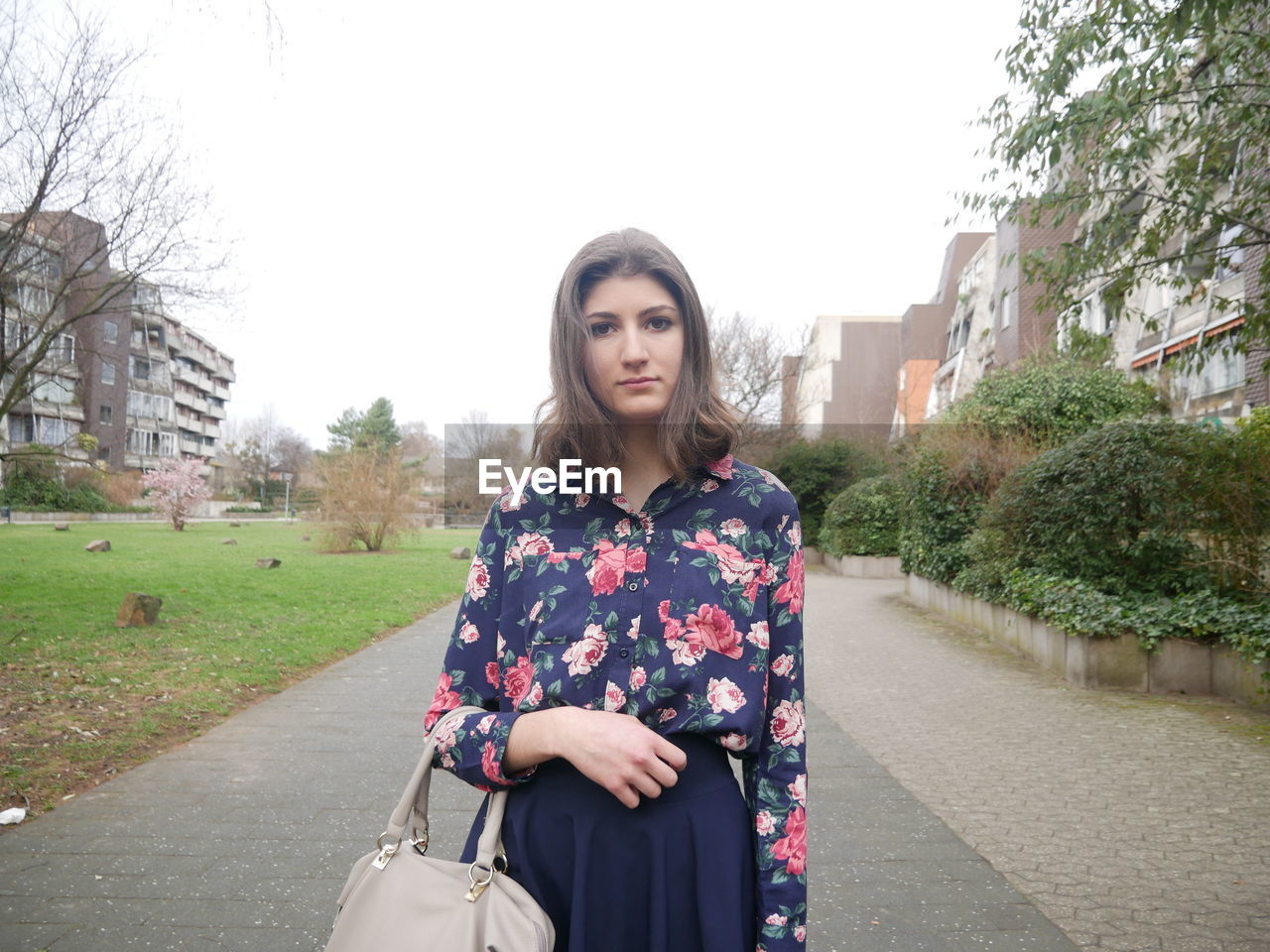 Portrait of young woman in park