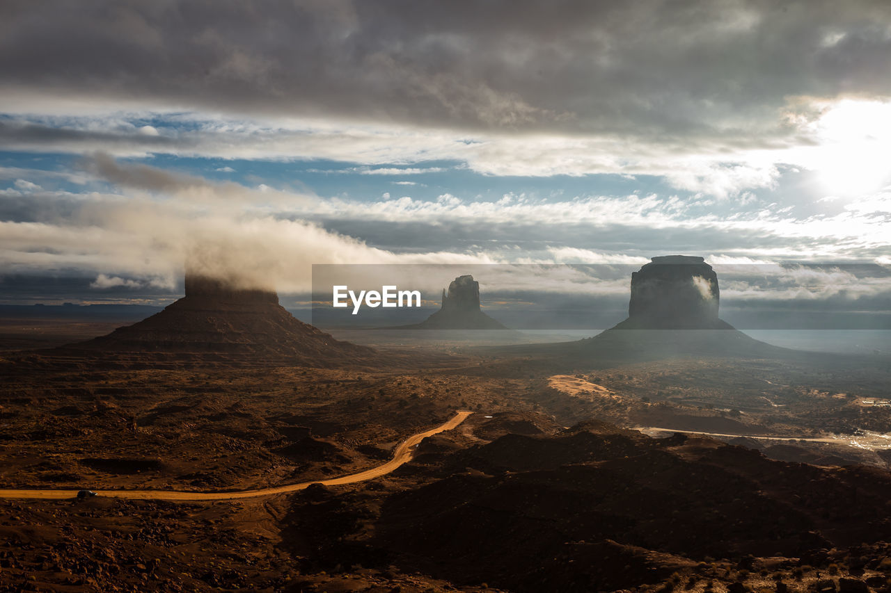 Scenic view of desert landscape against sky