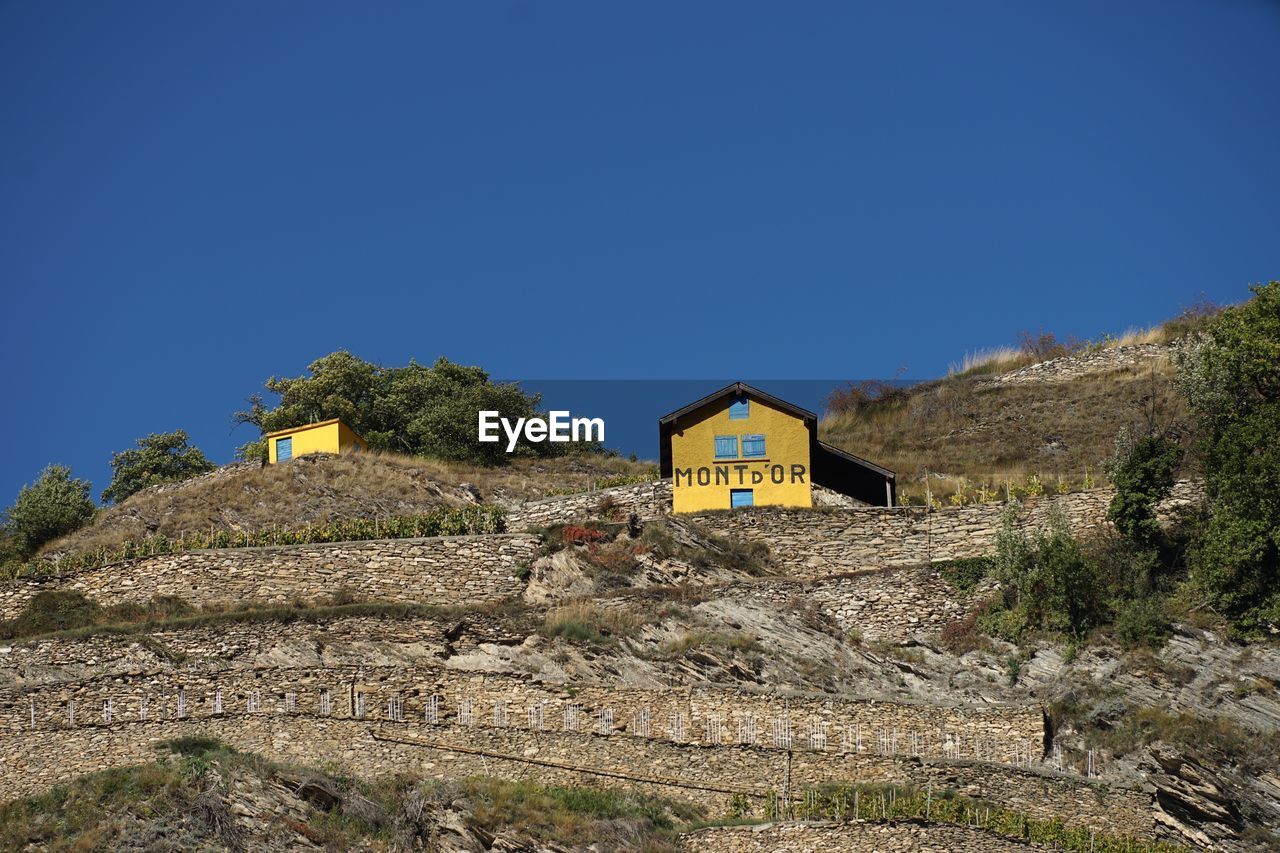 LOW ANGLE VIEW OF CASTLE ON HILL