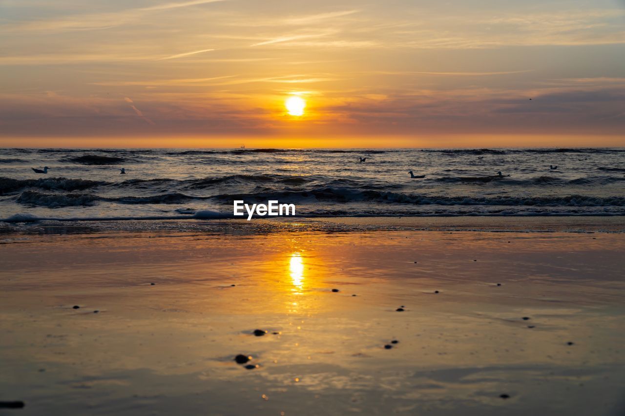 Scenic view of sea against sky during sunset