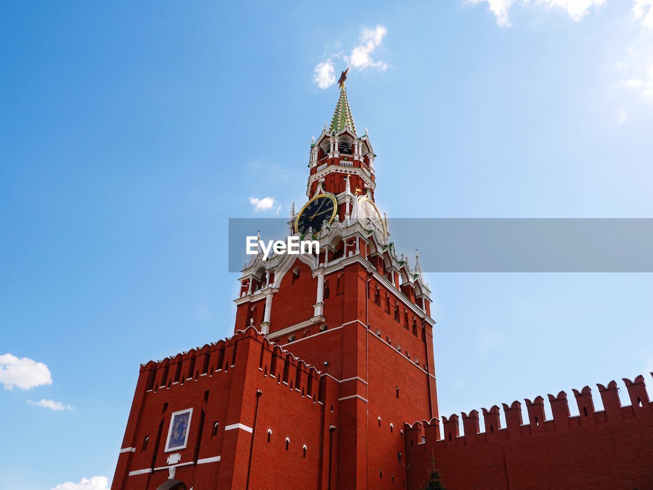 Low angle view of spasskaya tower against sky