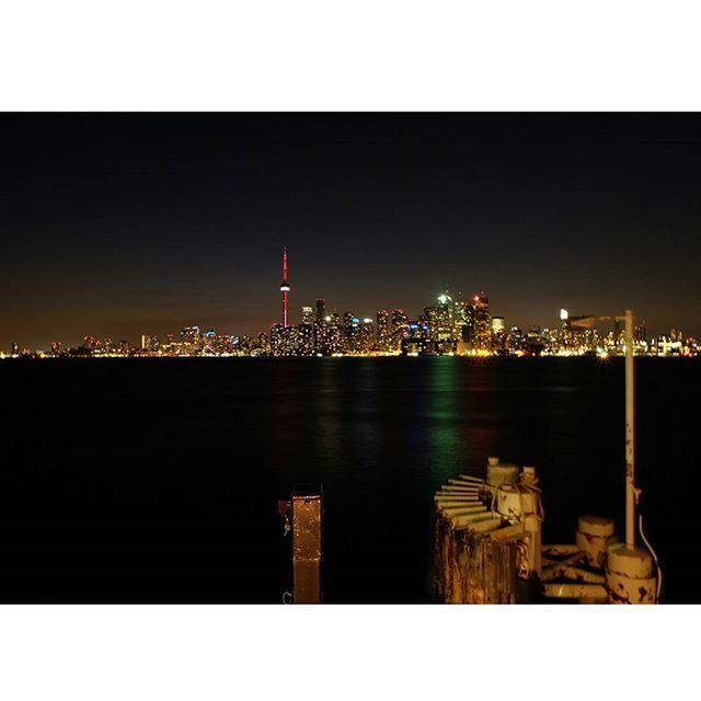 VIEW OF ILLUMINATED CITYSCAPE AT NIGHT