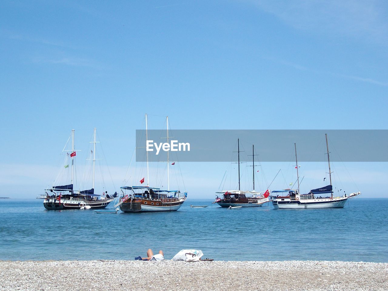 Boats on sea against sky